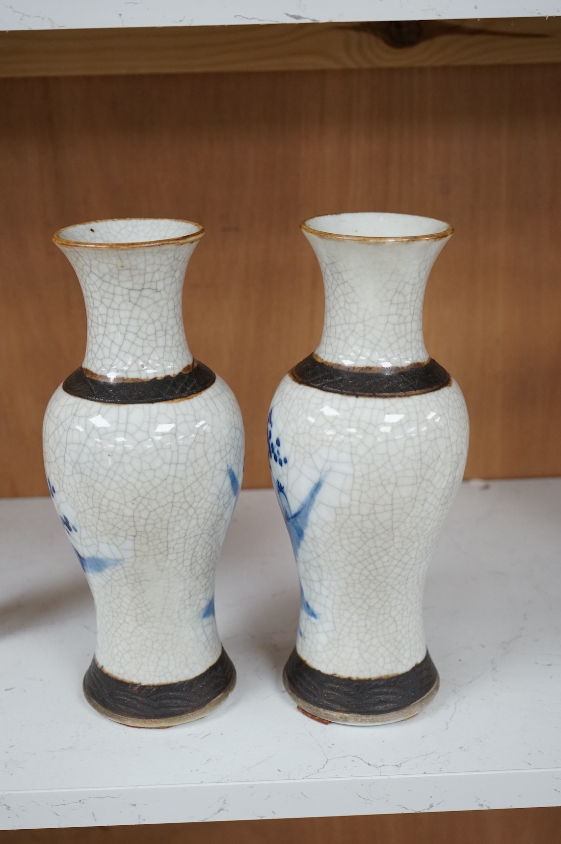 A pair of Chinese blue and white crackle glaze vases, late 19th century, 26cm high